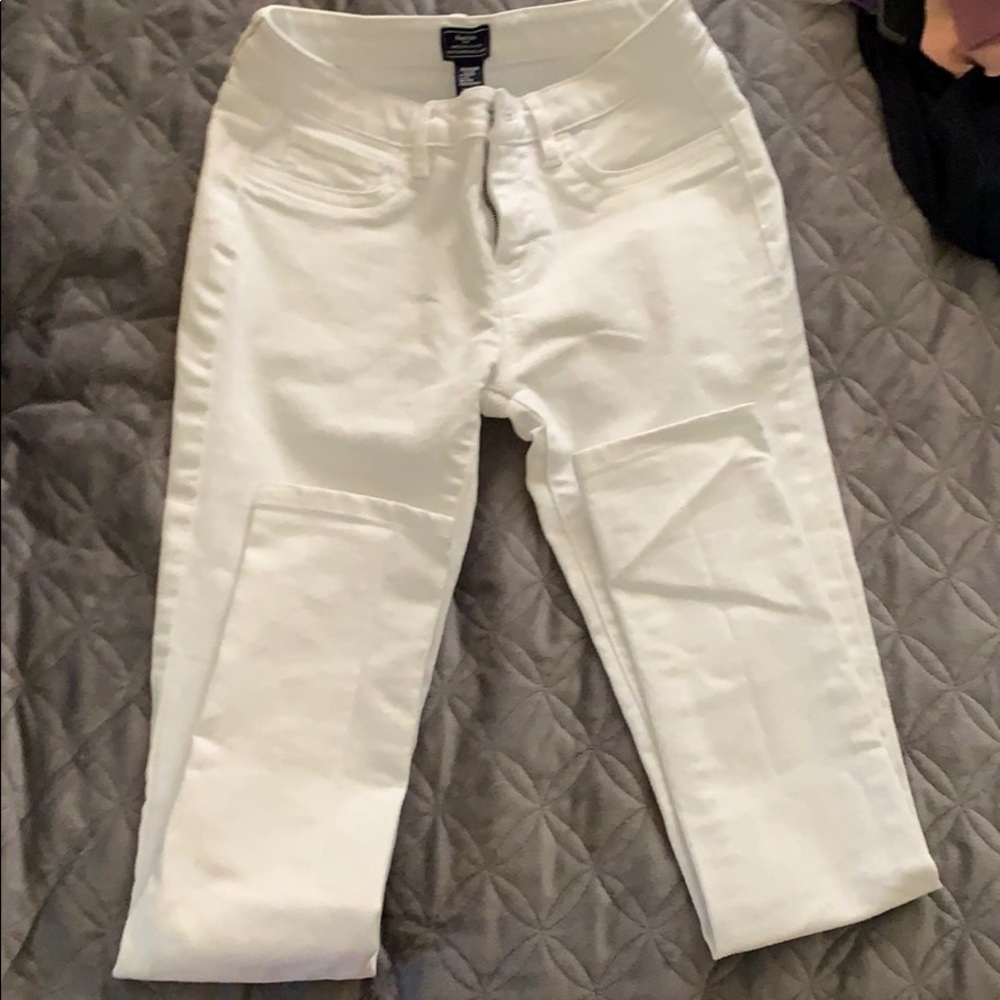 White jeans . NO rips .